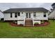 Back exterior view of home with large deck and stairs leading to the backyard at 165 Kimball Rd, China Grove, NC 28023