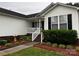 Charming home featuring a covered front porch and landscaped yard at 165 Kimball Rd, China Grove, NC 28023