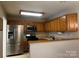 Kitchen view featuring stainless steel appliances and wooden cabinetry at 165 Kimball Rd, China Grove, NC 28023