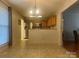 Eat-in kitchen featuring stainless steel refrigerator, adjacent to dining area with natural light at 165 Kimball Rd, China Grove, NC 28023