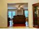 View of the living room with fireplace from dining room, with hardwood floors at 165 Kimball Rd, China Grove, NC 28023