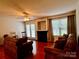Comfortable living room with warm wood floors, fireplace, and lots of natural light at 165 Kimball Rd, China Grove, NC 28023