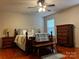 Comfortable main bedroom with hardwood floors, ceiling fan, and classic furnishings at 165 Kimball Rd, China Grove, NC 28023