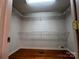 Walk-in closet with wire shelving, hardwood floors, and a bright skylight at 165 Kimball Rd, China Grove, NC 28023