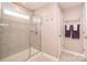 Bathroom featuring tiled walk-in shower with glass door and neutral color scheme at 17228 River Race Dr, Huntersville, NC 28078