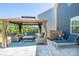 Outdoor living area with gazebo, comfortable seating and lush landscaping at 17228 River Race Dr, Huntersville, NC 28078