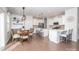 Bright kitchen with white cabinetry, stainless steel appliances, and a center island with bar seating at 17228 River Race Dr, Huntersville, NC 28078
