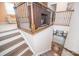 Staircase landing with decorative railing offers views to the lower level and living room at 17228 River Race Dr, Huntersville, NC 28078