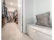 Spacious walk-in closet featuring ample storage and seating bench at 17228 River Race Dr, Huntersville, NC 28078