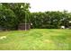 Sprawling backyard with lush greenery, offering endless possibilities for recreation and gardening at 175 Leonard Rd, Salisbury, NC 28146