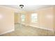 Bright bedroom with sliding mirror closet and tile floors at 175 Leonard Rd, Salisbury, NC 28146