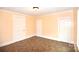 Minimalist bedroom with three door and one window, offering potential for creative design at 175 Leonard Rd, Salisbury, NC 28146