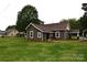 Rear view of a cozy home with a spacious yard, perfect for outdoor activities and relaxation at 175 Leonard Rd, Salisbury, NC 28146