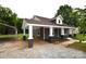 Side view of a well-maintained home, with a covered parking area, blending functionality and charm at 175 Leonard Rd, Salisbury, NC 28146