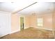 Spacious living room featuring neutral walls, window and ceramic tile floors at 175 Leonard Rd, Salisbury, NC 28146