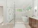 Bright bathroom with large glass enclosed shower and soaking tub at 1814 Therrell Farms Rd, Waxhaw, NC 28173