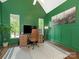 Bright home office with green accent wall, lots of light and comfortable workspace at 1814 Therrell Farms Rd, Waxhaw, NC 28173
