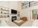 Open living room with fireplace, built-in shelving, and a view of the upper floor at 1814 Therrell Farms Rd, Waxhaw, NC 28173