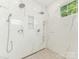 Large glass shower with marble style tile and multiple shower heads at 1814 Therrell Farms Rd, Waxhaw, NC 28173