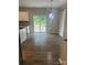 Bright dining area with wood floors and sliding glass doors to outdoor patio at 184 Cherry Birch St, Mooresville, NC 28117