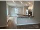Kitchen and dining area features granite counters and stainless steel appliances at 184 Cherry Birch St, Mooresville, NC 28117