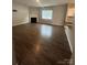 Bright living room boasts hardwood floors, fireplace, and lots of natural light at 184 Cherry Birch St, Mooresville, NC 28117