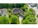 Overhead view of the property with a circular driveway, lush landscaping, and a sprawling lawn at 18843 Flat Shoals Dr, Cornelius, NC 28031