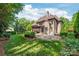 Well-manicured backyard featuring a spacious patio area, lush greenery, and mature trees for added privacy at 18843 Flat Shoals Dr, Cornelius, NC 28031