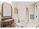 Elegant bathroom featuring a decorative mirror and vanity, with a shower in the next room at 18843 Flat Shoals Dr, Cornelius, NC 28031