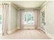 Bright bedroom with neutral decor, large window with patterned curtains, and views of the backyard at 18843 Flat Shoals Dr, Cornelius, NC 28031