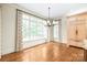 Bright breakfast nook with floor to ceiling windows and a built-in cabinet for a sun-soaked dining experience at 18843 Flat Shoals Dr, Cornelius, NC 28031