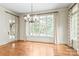 A bright breakfast nook is brightly lit by many windows overlooking the backyard at 18843 Flat Shoals Dr, Cornelius, NC 28031