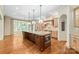 Open concept kitchen with large island, granite countertops, and stainless steel appliances is perfect for entertaining at 18843 Flat Shoals Dr, Cornelius, NC 28031