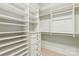 Bright walk-in closet with built-in shelves and drawers, providing ample storage at 18843 Flat Shoals Dr, Cornelius, NC 28031