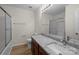 Bathroom featuring a light wood floor, a large vanity, granite countertops and a tub and shower combo at 2018 Rockycreek Ln, Monroe, NC 28112
