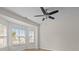 Bright bedroom with light-colored walls, wood floors, a ceiling fan, and large windows at 2018 Rockycreek Ln, Monroe, NC 28112