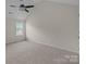 Neutral bedroom featuring carpeted flooring, a ceiling fan, and ample natural light at 2018 Rockycreek Ln, Monroe, NC 28112