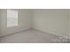 Neutral bedroom with carpet and a window at 2018 Rockycreek Ln, Monroe, NC 28112