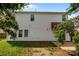 Back view of the house featuring vinyl siding and an awning at 2018 Rockycreek Ln, Monroe, NC 28112