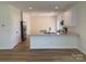 Open floor plan showcases kitchen with island, stainless appliances, and white cabinets at 2018 Rockycreek Ln, Monroe, NC 28112