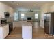 Stylish kitchen featuring white cabinets, stainless steel appliances, granite countertops, and open layout at 2018 Rockycreek Ln, Monroe, NC 28112