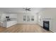 Living room with fireplace, open concept, modern kitchen and large windows at 2018 Rockycreek Ln, Monroe, NC 28112