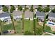 Aerial view of backyards featuring patios, seating areas, lush landscaping, and outdoor living spaces at 214 Blossom Ridge Dr, Mooresville, NC 28117