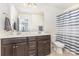Bathroom featuring double sinks and a shower with a striped curtain at 214 Blossom Ridge Dr, Mooresville, NC 28117