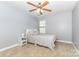 Cozy bedroom with a ceiling fan and a neutral color scheme at 214 Blossom Ridge Dr, Mooresville, NC 28117