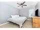 Comfortable bedroom with natural light and a ceiling fan at 214 Blossom Ridge Dr, Mooresville, NC 28117