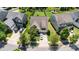 Aerial view of home with well-maintained lawn and landscaping, and paved driveway in a suburban neighborhood at 214 Blossom Ridge Dr, Mooresville, NC 28117