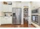 Kitchen featuring stainless steel refrigerator, built-in microwave/oven, and walk-in pantry at 214 Blossom Ridge Dr, Mooresville, NC 28117