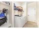 Laundry room featuring a modern washer and dryer set with shelving at 214 Blossom Ridge Dr, Mooresville, NC 28117
