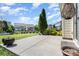 Back patio and yard surrounded by landscaping and trees at 214 Blossom Ridge Dr, Mooresville, NC 28117